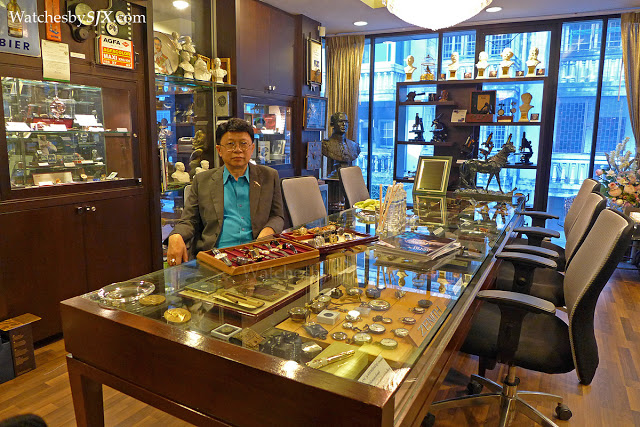 Prasart Vidhayapat seated inside his private Bangkok watch gallery