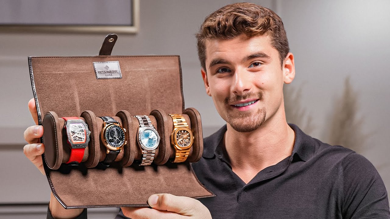 Iman Gadzhi seated beside cases from his watch collection
