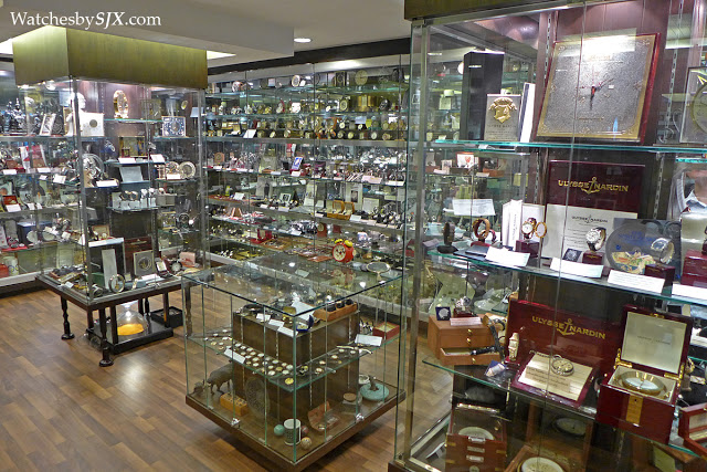 Prasart Vidhayapat standing inside his private watch gallery in Bangkok