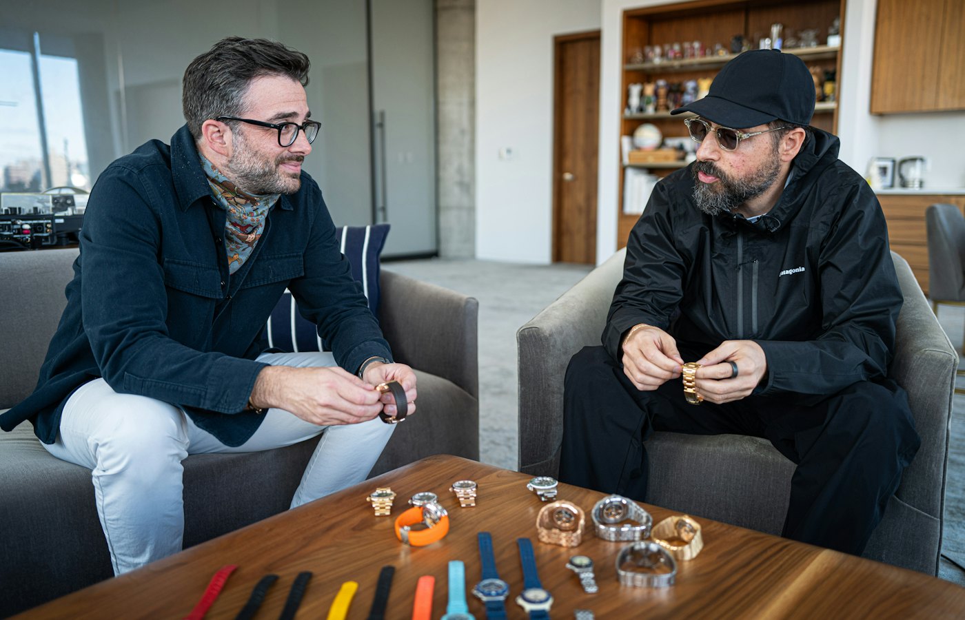 Ronnie Fieg seated with a selection from his watch collection